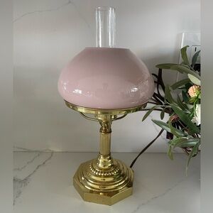 vintage brass lamp with a pink milk glass shade